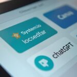 A marketer looking at their laptop which displays a rising profit graph and dollar signs, symbolizing success with CPA marketing.